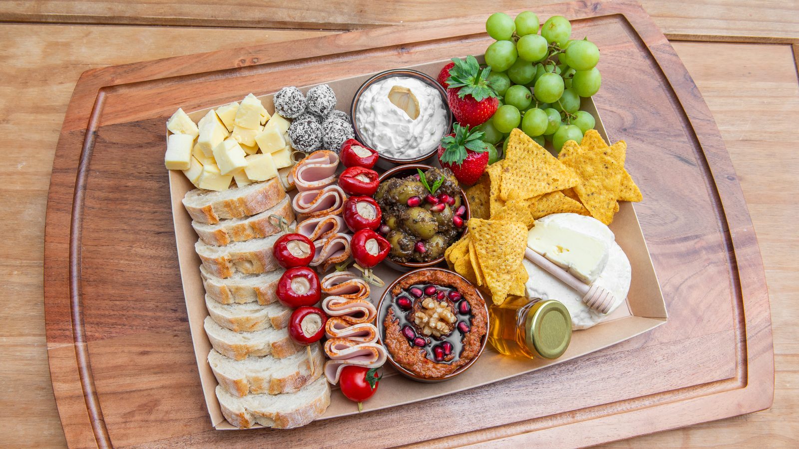 The Classic Platter — three dips, cheeses, halal turkey, fruit and bread
